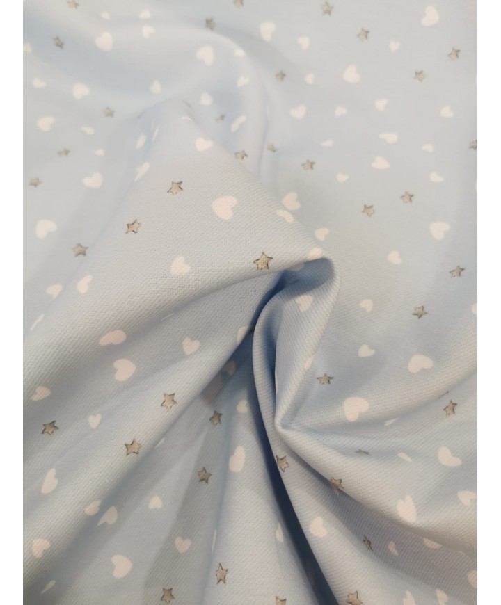 Algodon 100% fondo azúl con corazones y estrellas 1.50